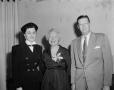 Photograph: [Photograph of Margaret McDonald with two people]