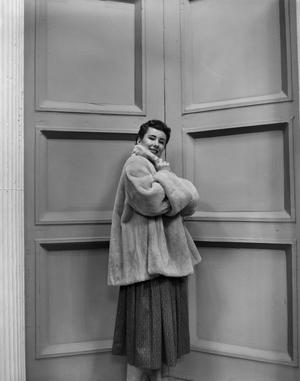 [Photograph of Ann Alden in a fur coat]