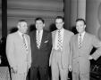 Photograph: [Photo of Roy Bacus and three other men]