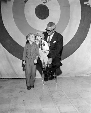 [Photograph of Bobby Peters and page boy]