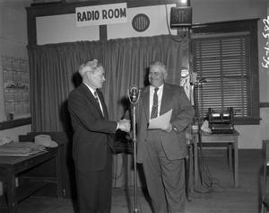 [Photograph of Mr. Woodform in radio room]