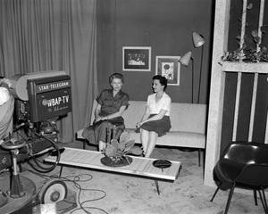 Primary view of object titled '[Margaret McDonald and a guest seated on set]'.