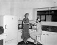 Photograph: [Margaret McDonald in kitchen at Mrs. Tuckers Shortening Plant]