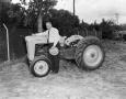 Photograph: [Doc Rhuman and Ford tractor]