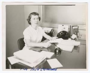 [Photograph of Fay Cothern in an office]