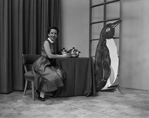 [Ann Alden with penguin]