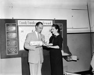 [Photo of Margaret McDonald and Dale Hart and cookbook bread]