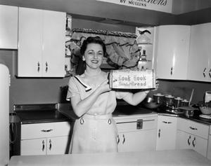 [Photograph of Margaret McDonald advertising Cook Book bread]