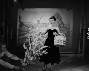 [Photograph of Ann Alden holding a basket]