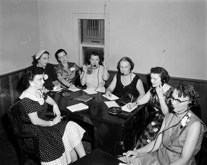 [Photograph of women at a table]