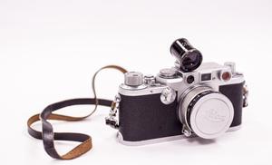 [Leica IIIc camera with lens cap on]