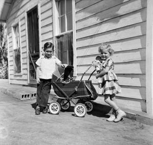 [Timothy and Carol with a Stroller]