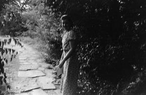 [Photograph of Mary Liddell on a stone path]