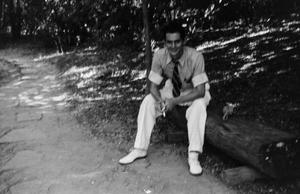 [Photograph of Byrd Williams III sitting outdoors]
