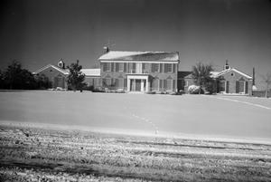 [Photograph of a snow-covered house in Fort Worth]