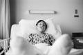 Photograph: [Photograph of a young man in a hospital bed]