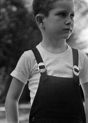 [Photograph of Tim Williams in overalls, 2]