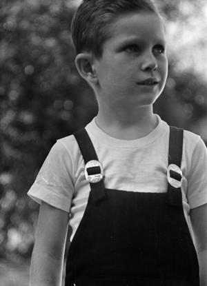 [Photograph of Tim Williams in overalls]
