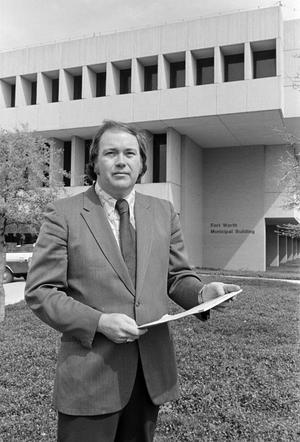 [Photo of Bill Hix with a notepad at court house]