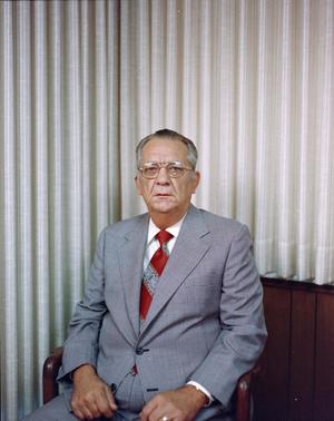 [Photograph of a man in a suit and a red tie, 2]