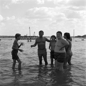 [Norman with children at the beach]