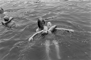 [Children swimming in a lake]