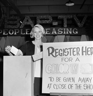 [Woman registering to win a television]