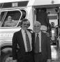 Photograph: [Photograph of Blake Byrne and another man posing by a bus]