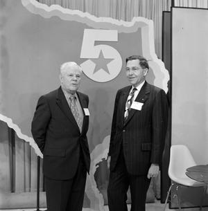 [Two men with a Texas cutout]