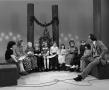 Photograph: [Photograph of Bill Kelley sitting with children at a KXAS Christmas …