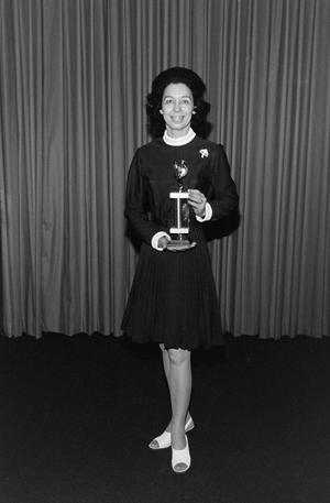 [Freda Holt posing with her trophy]