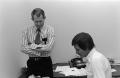 Photograph: [Clint Bourland and Jack Brown at work]