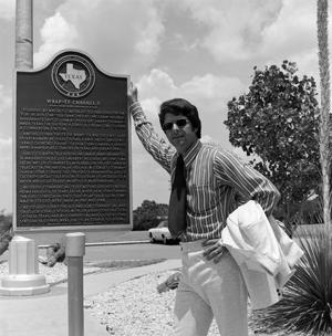 [Don Shores with a historical marker]