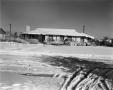 Photograph: [Photograph of the front exterior of a snowy house]