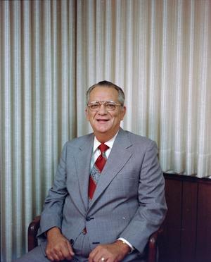 [Photograph of a man in a suit and a red tie, 1]