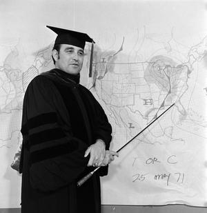 [Ron Godbey wearing a cap and gown]