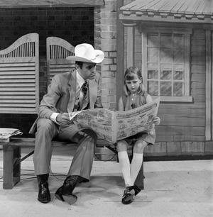 [Kelley and a young girl reading]