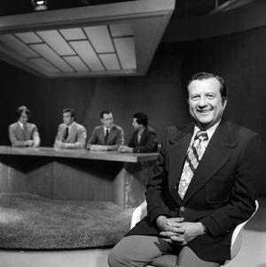 [Picture of news anchormen on set]