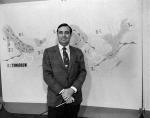 [Ron Godby with a weather map]