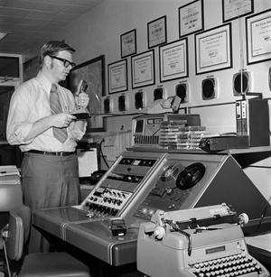 [Unknown man with a control panel]