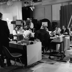 [Photograph of individuals working at the KXAS-TV station]