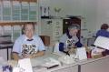 Photograph: [Employees working in an office with matching t-shirts]