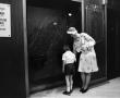 Primary view of [Woman and child near drinking fountains, 5]
