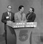 Photograph: [Three men standing behind a podium]
