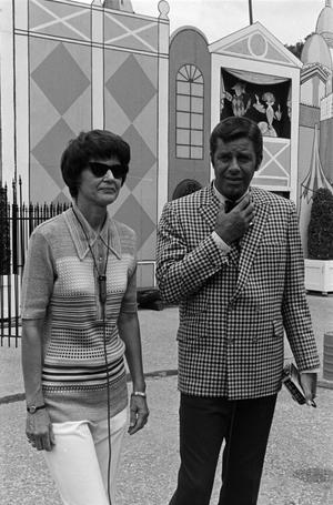 [Jerry Lewis standing with a woman]