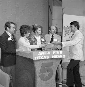 [Five individuals on the WBAP set]