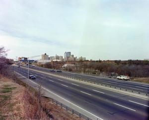 [Photo of highway and skyline]