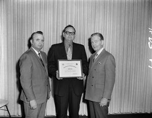 [Frank Mills and two men with the Civil Defense Award]