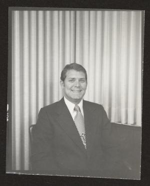 [Photograph of a man in a suit and a patterned tie, 6]