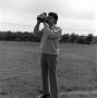 Photograph: [Ron Spain standing outside]
